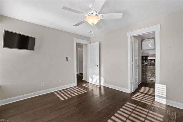 unfurnished bedroom featuring ceiling fan, a closet, and dark hardwood / wood-style floors