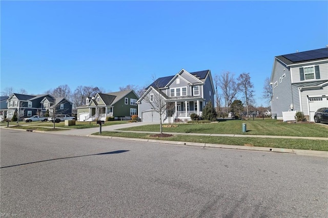 view of front of house featuring a front lawn and a garage