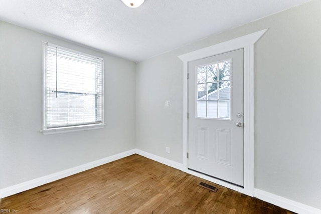 entrance foyer featuring hardwood / wood-style flooring