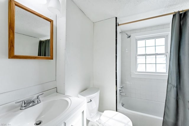 full bathroom featuring shower / bathtub combination with curtain, a textured ceiling, vanity, and toilet