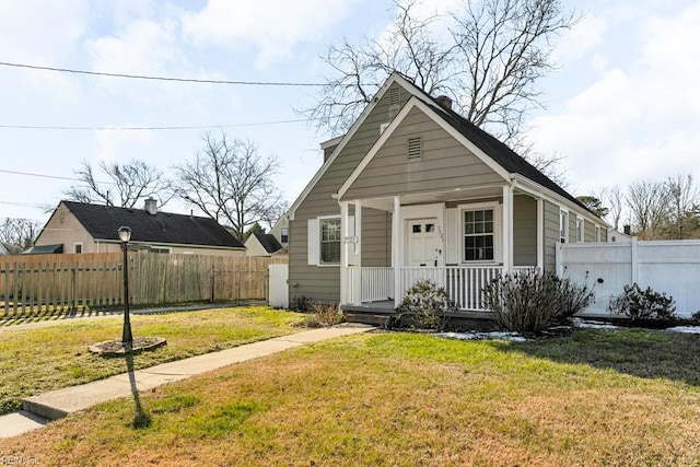 bungalow-style house featuring a front yard