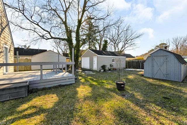 view of yard featuring a shed and a wooden deck