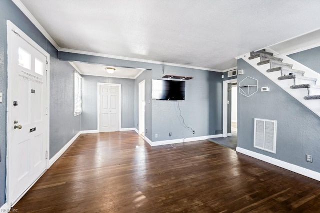 foyer featuring dark wood-type flooring and crown molding