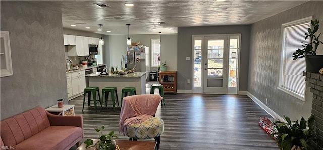 living room with sink and dark hardwood / wood-style flooring