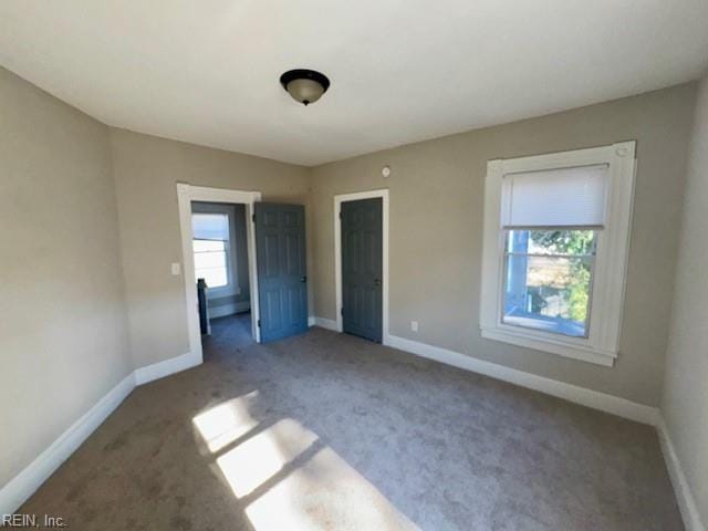 unfurnished bedroom with carpet flooring