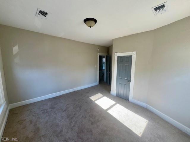 empty room featuring carpet flooring