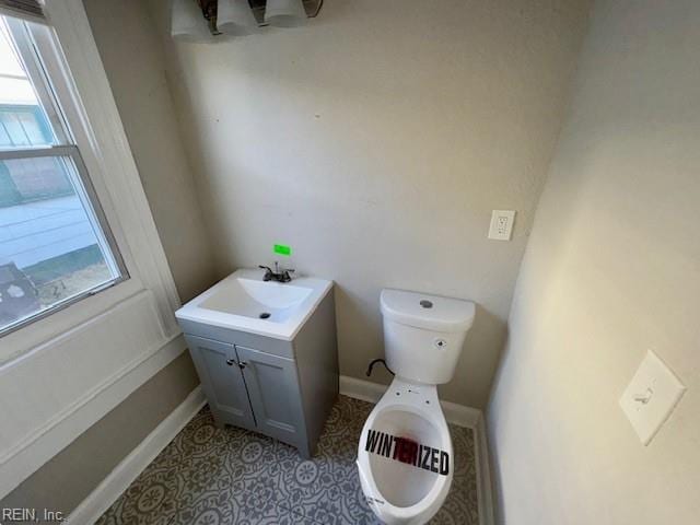 bathroom with toilet and vanity