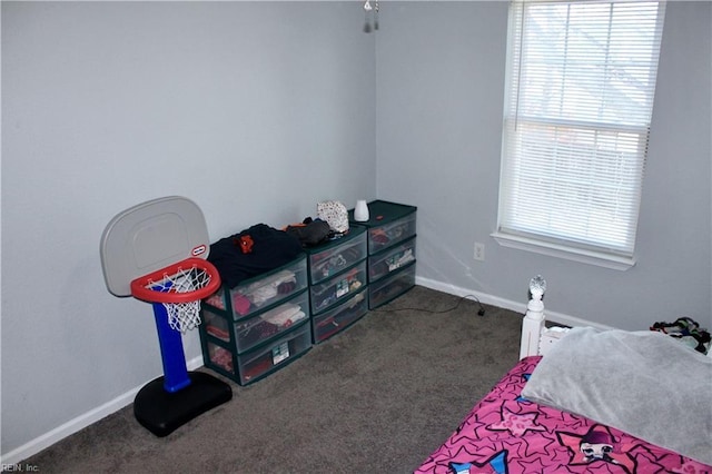 bedroom featuring dark colored carpet