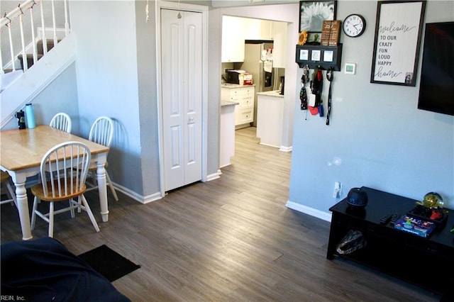 dining area with wood-type flooring