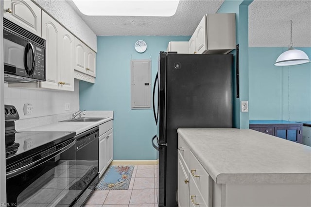 kitchen with sink, a textured ceiling, light tile patterned floors, hanging light fixtures, and black appliances