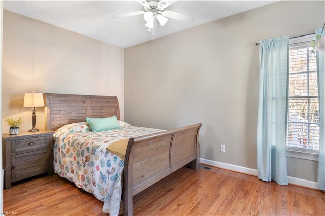 bedroom featuring ceiling fan and light hardwood / wood-style floors