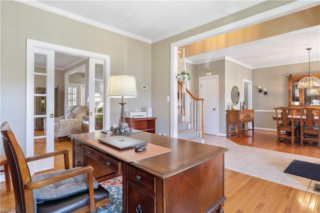 office space with french doors, a chandelier, light wood-type flooring, and crown molding