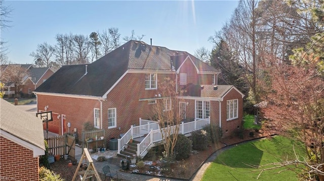 exterior space featuring a yard and central AC unit