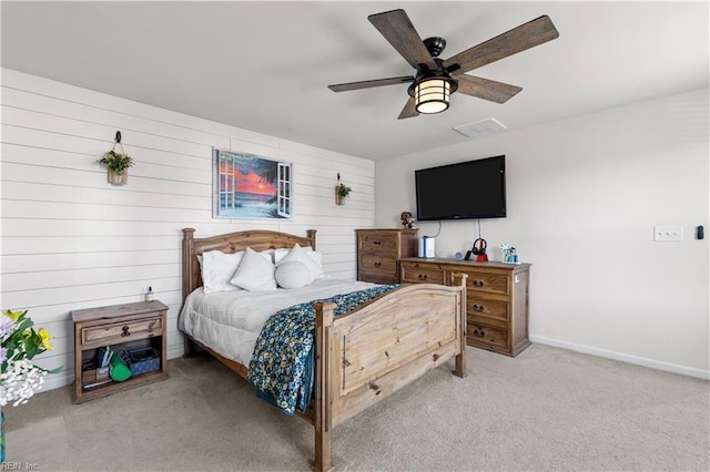 bedroom with ceiling fan and light colored carpet