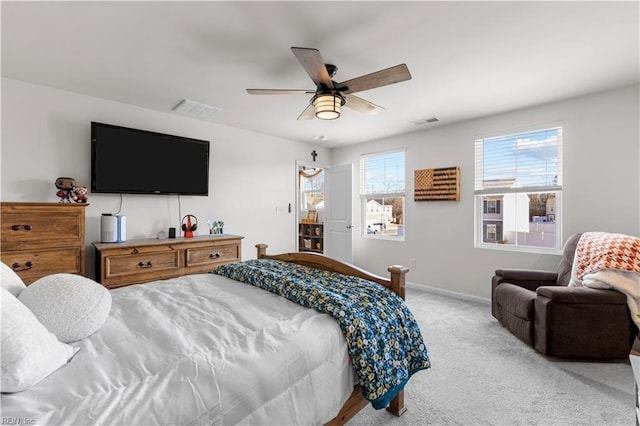 bedroom with ceiling fan and light colored carpet