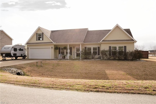 view of front of house featuring a garage and a porch