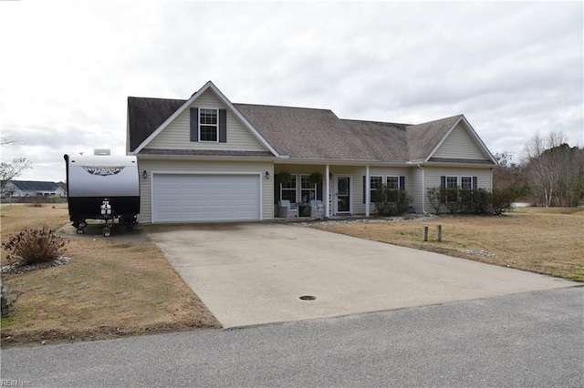 view of front of home featuring a front lawn and a garage