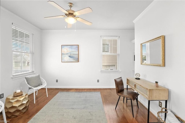 office area featuring hardwood / wood-style flooring, ornamental molding, and ceiling fan