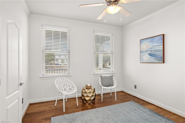 sitting room with ceiling fan, a wealth of natural light, ornamental molding, and hardwood / wood-style flooring