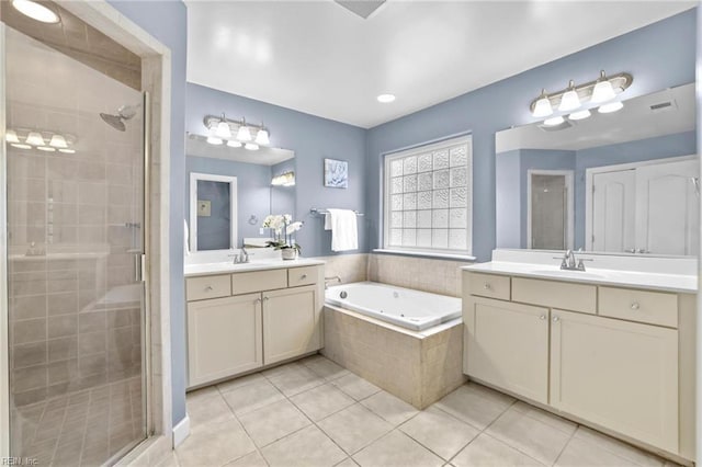 bathroom featuring tile patterned floors, vanity, and independent shower and bath