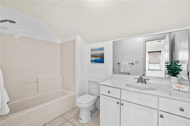 full bathroom with lofted ceiling, washtub / shower combination, tile patterned floors, vanity, and toilet