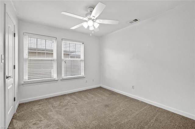 unfurnished room with ceiling fan and carpet flooring