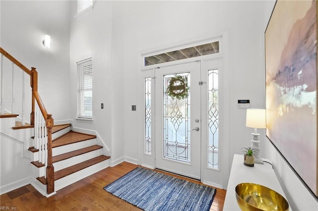 entryway with hardwood / wood-style floors