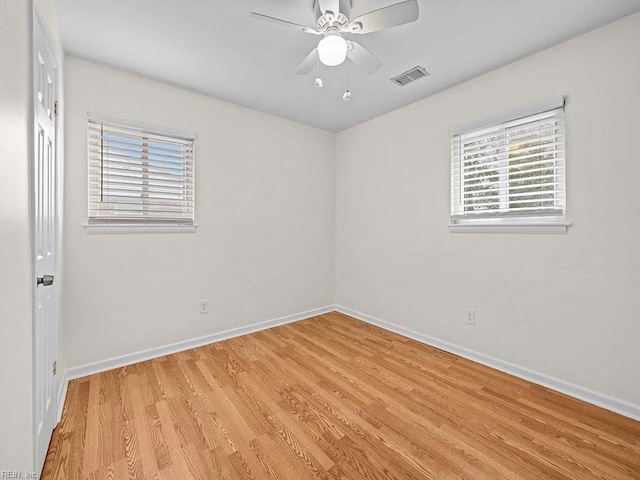 empty room featuring ceiling fan and light hardwood / wood-style floors