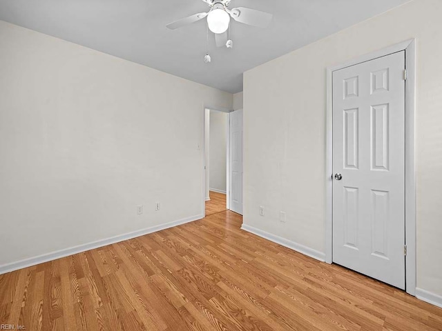 unfurnished bedroom featuring ceiling fan and light hardwood / wood-style floors