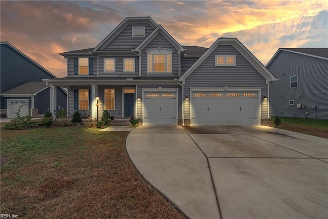 craftsman inspired home featuring covered porch and a lawn