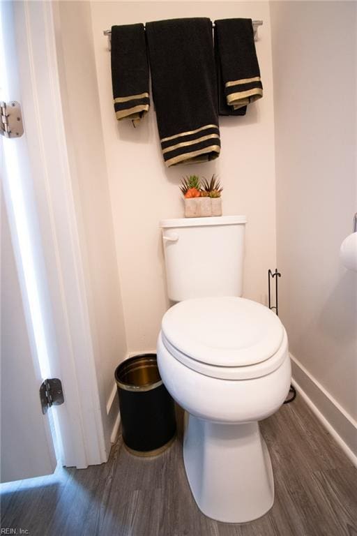 bathroom featuring toilet and hardwood / wood-style flooring