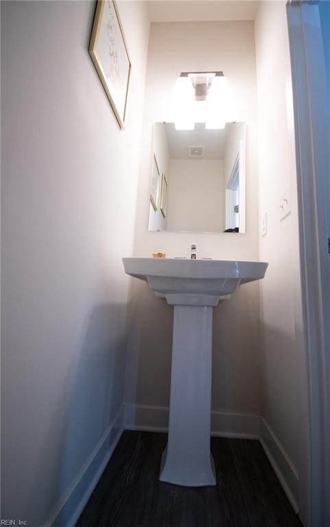 bathroom featuring wood-type flooring