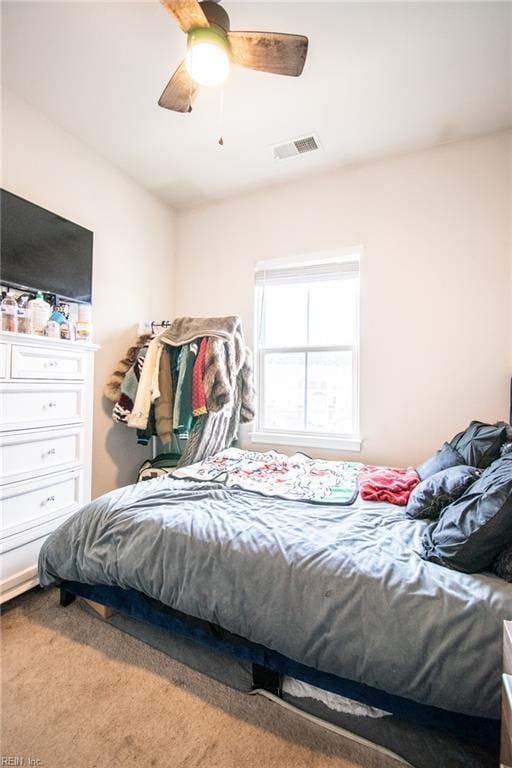 carpeted bedroom featuring ceiling fan