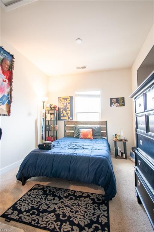 bedroom featuring light carpet