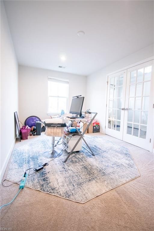 home office with carpet and french doors