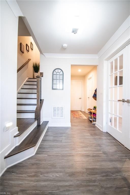 interior space featuring french doors and dark hardwood / wood-style floors