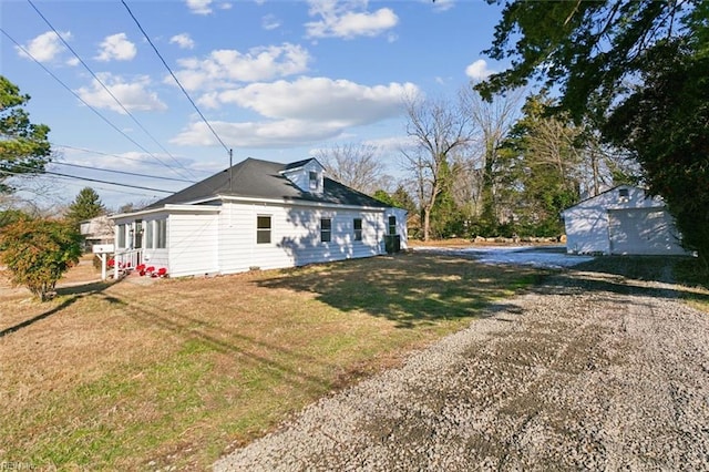 view of side of property featuring a yard