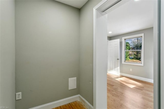 washroom with light hardwood / wood-style flooring