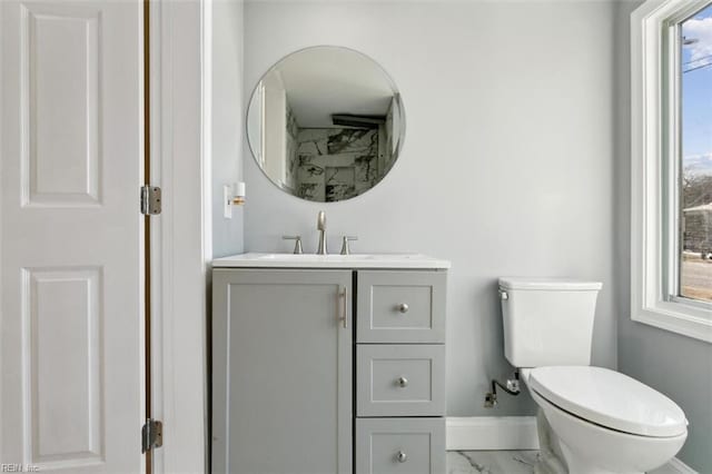 bathroom featuring toilet and vanity