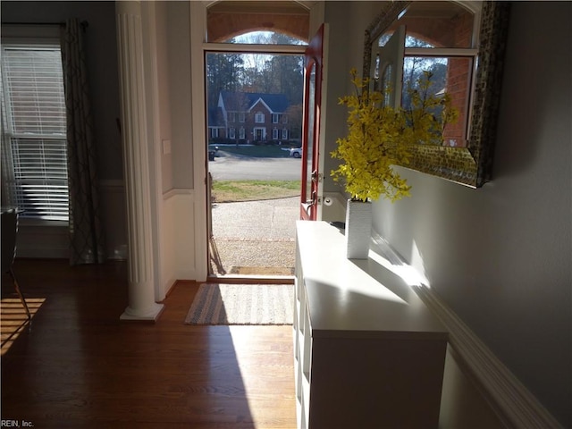 doorway to outside featuring dark wood-type flooring