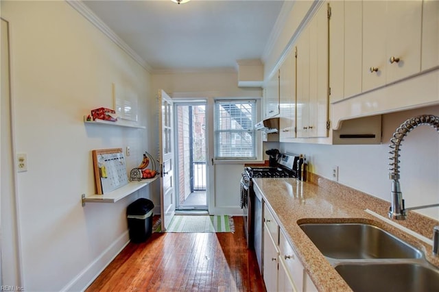 kitchen featuring stainless steel range with gas cooktop, light stone countertops, crown molding, white cabinets, and sink