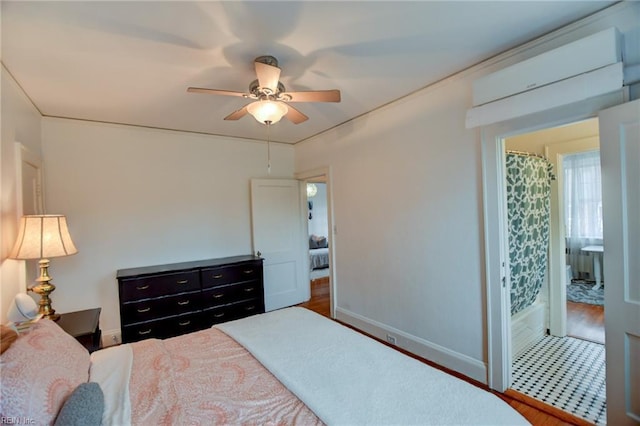 bedroom featuring ceiling fan and ensuite bathroom