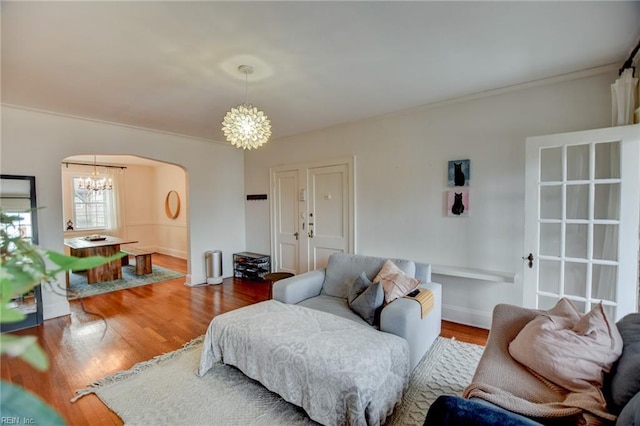 living room with a chandelier and hardwood / wood-style flooring