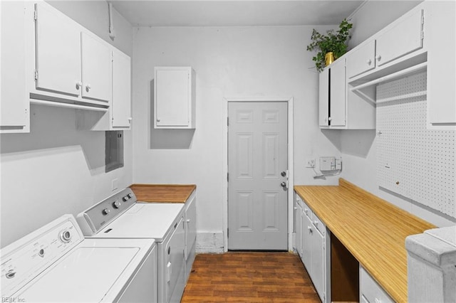 washroom featuring washer and clothes dryer, dark hardwood / wood-style floors, and cabinets