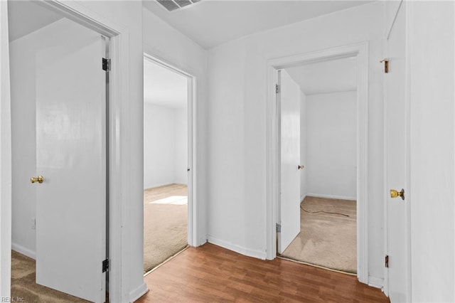 hallway featuring hardwood / wood-style flooring