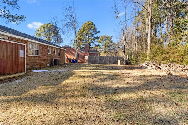 view of yard featuring central AC unit