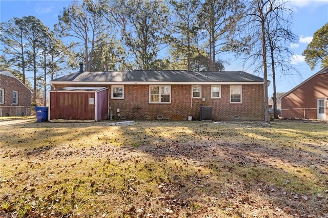 rear view of house with a lawn