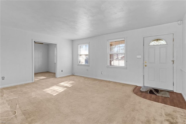 entrance foyer with light carpet