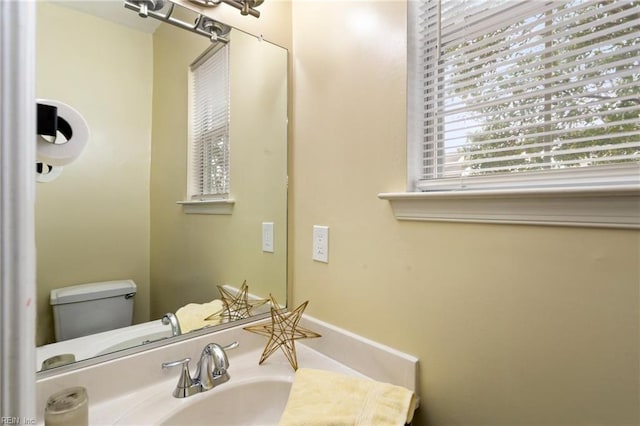 bathroom featuring toilet and sink