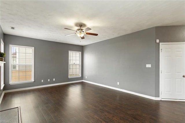 spare room featuring ceiling fan and dark hardwood / wood-style floors